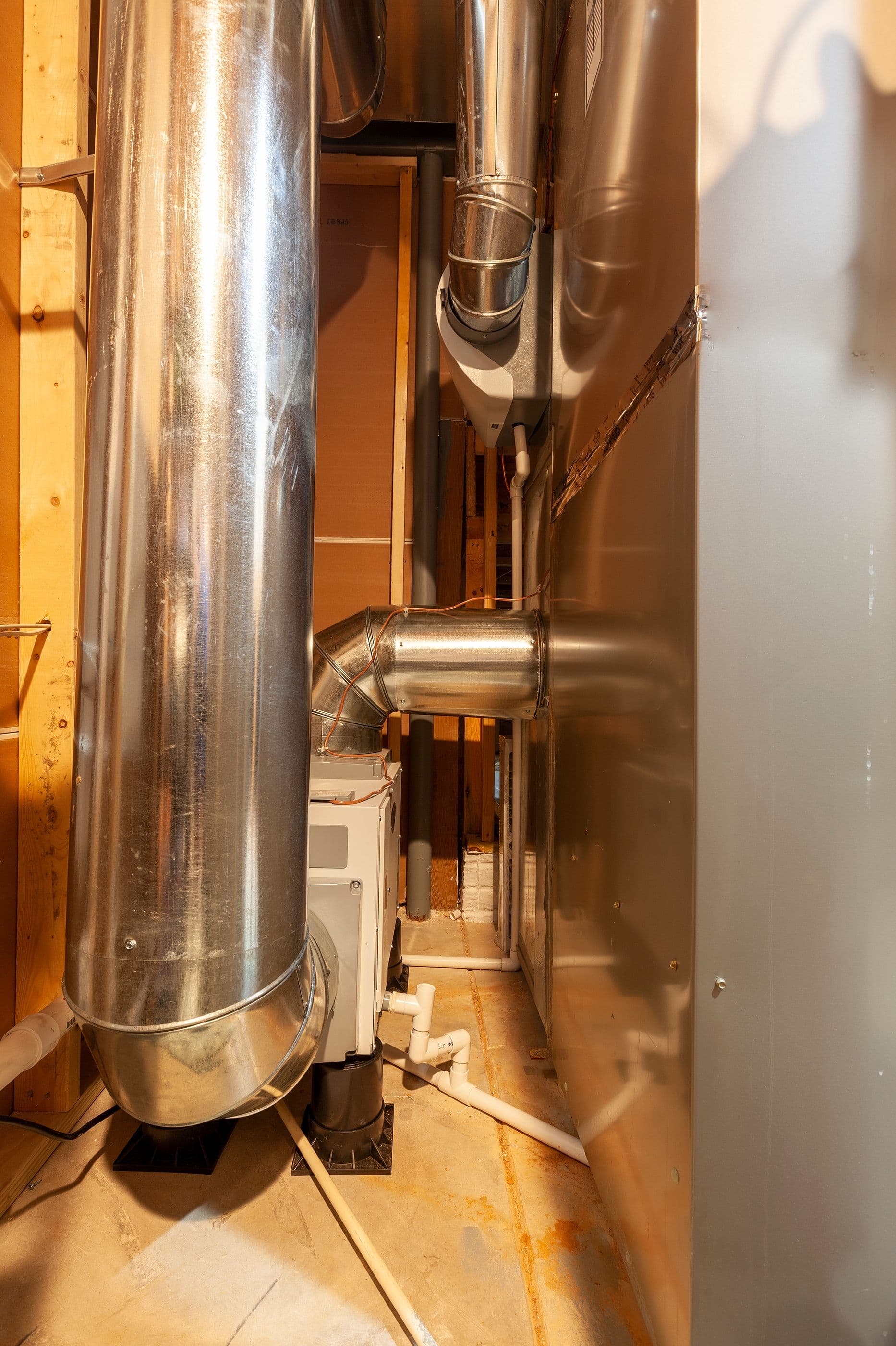 Save Download Preview A wholehouse heavy duty dehumidifier with its duct attached to hvac furnace system of an house. This samples humidity of the circulating air and removes moisture creating comfort in the entire house.